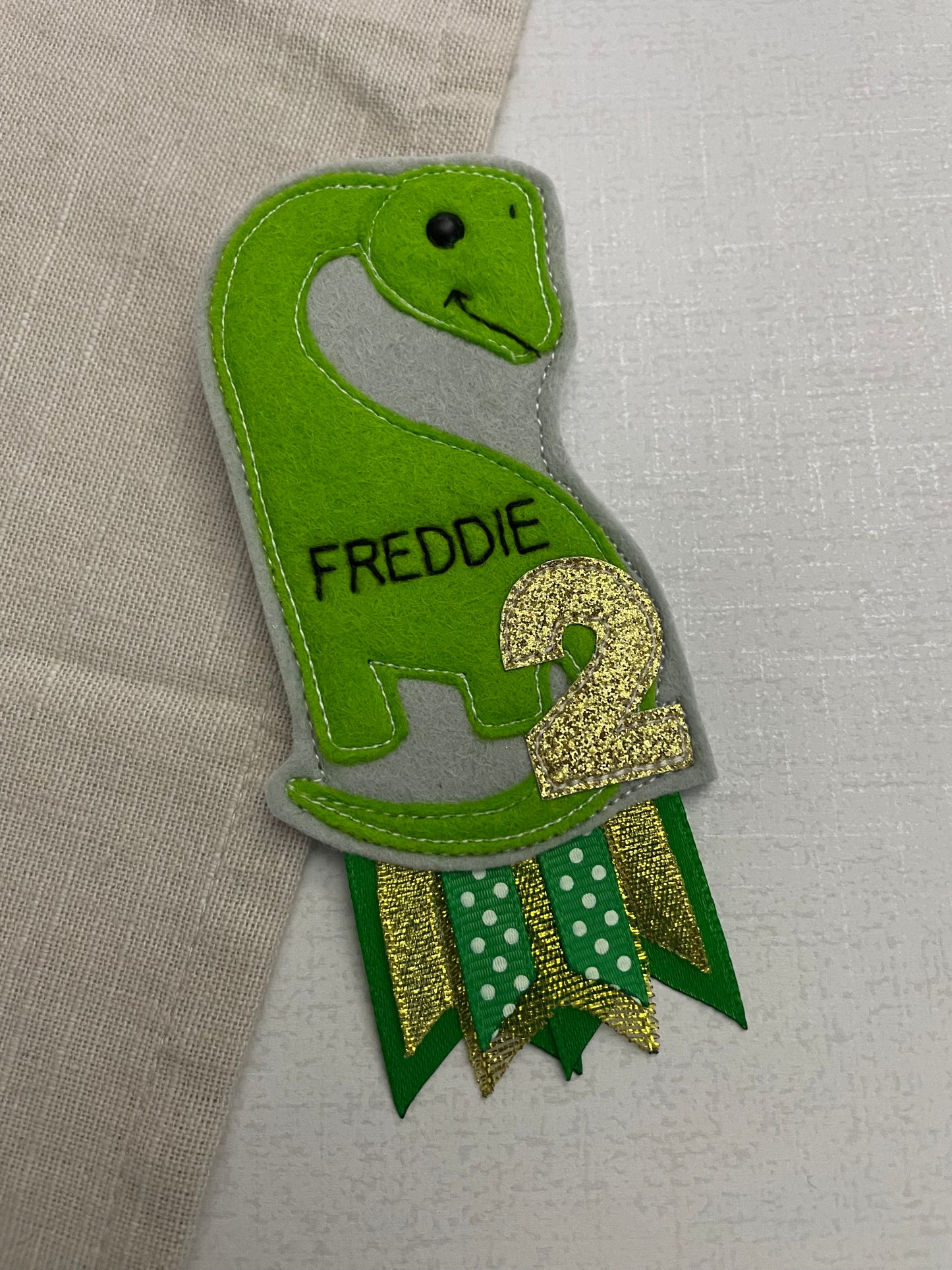 Brachiosaurus birthday badge