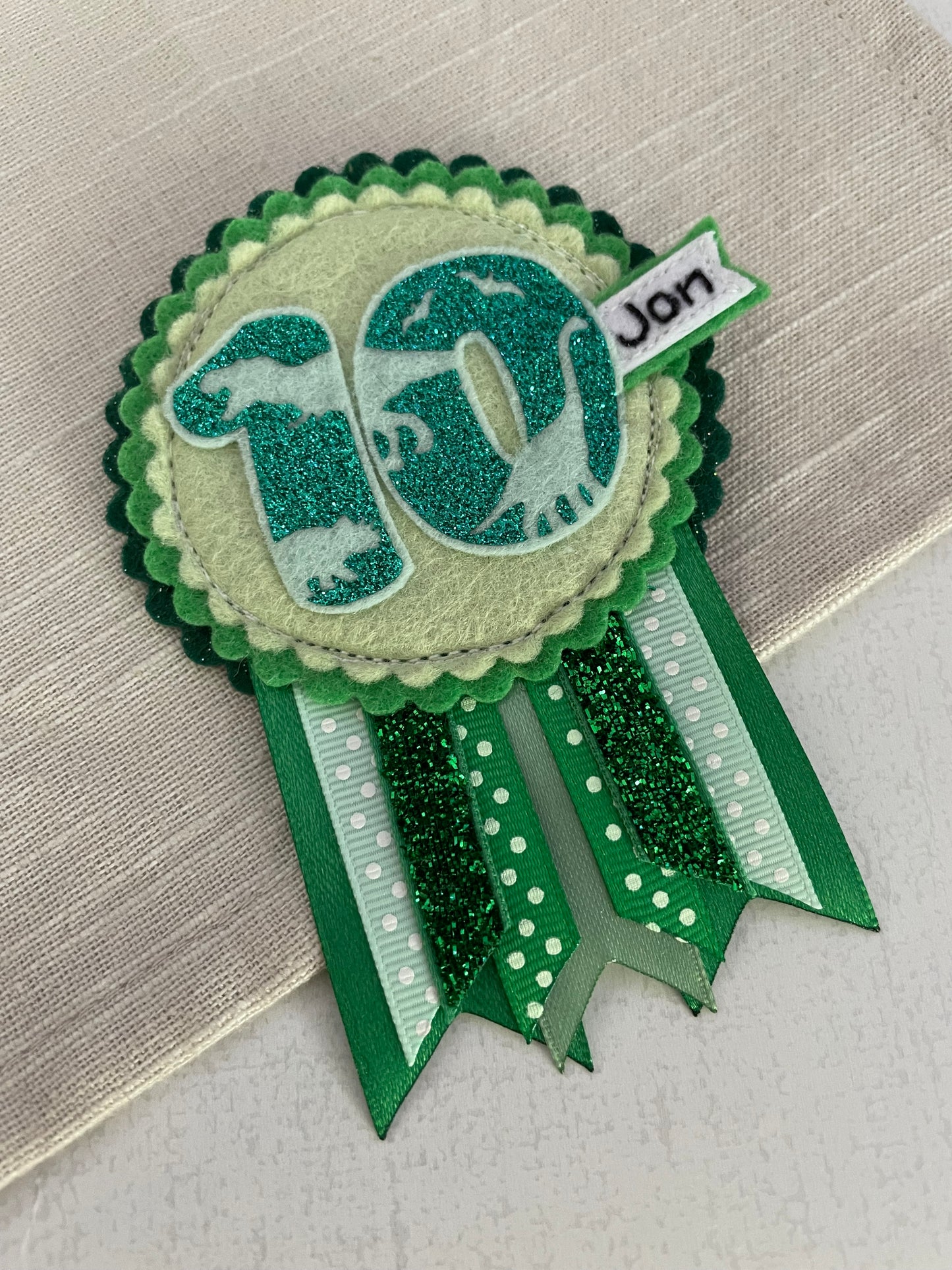 Dinosaur birthday rosette