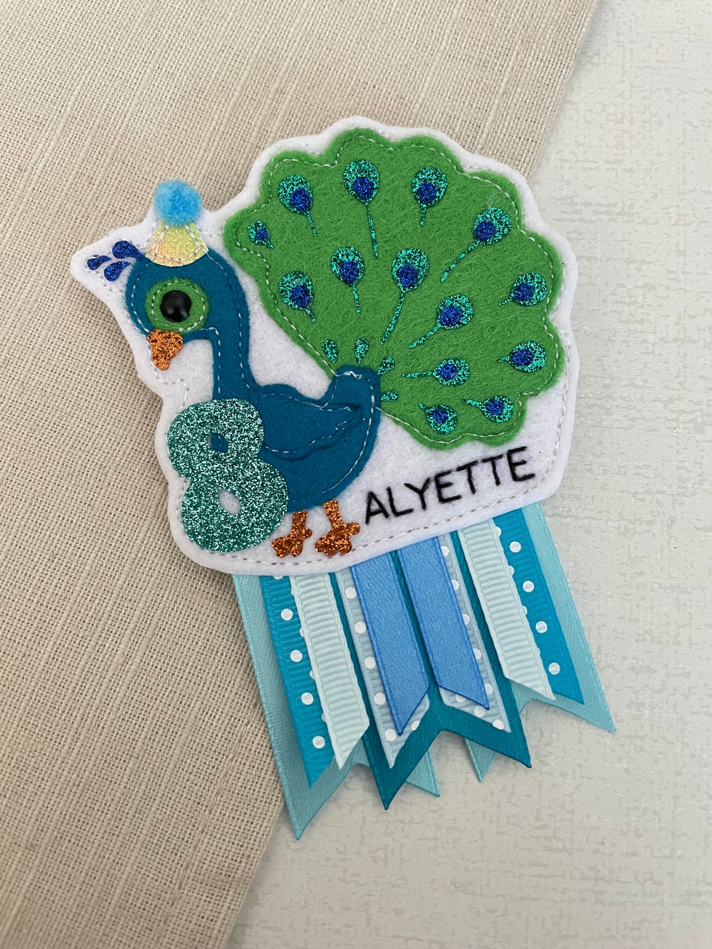 Peacock birthday badge