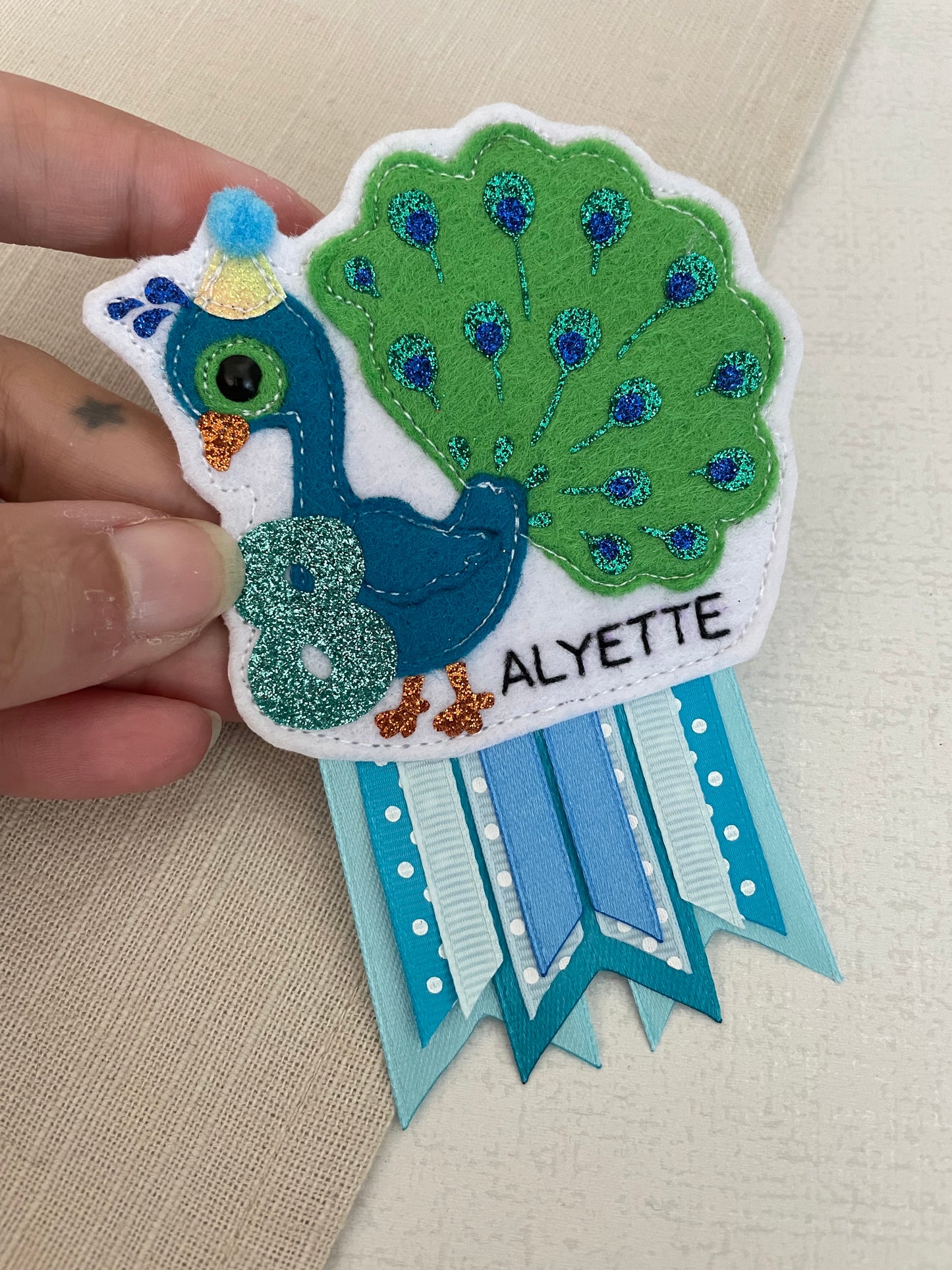 Peacock birthday badge