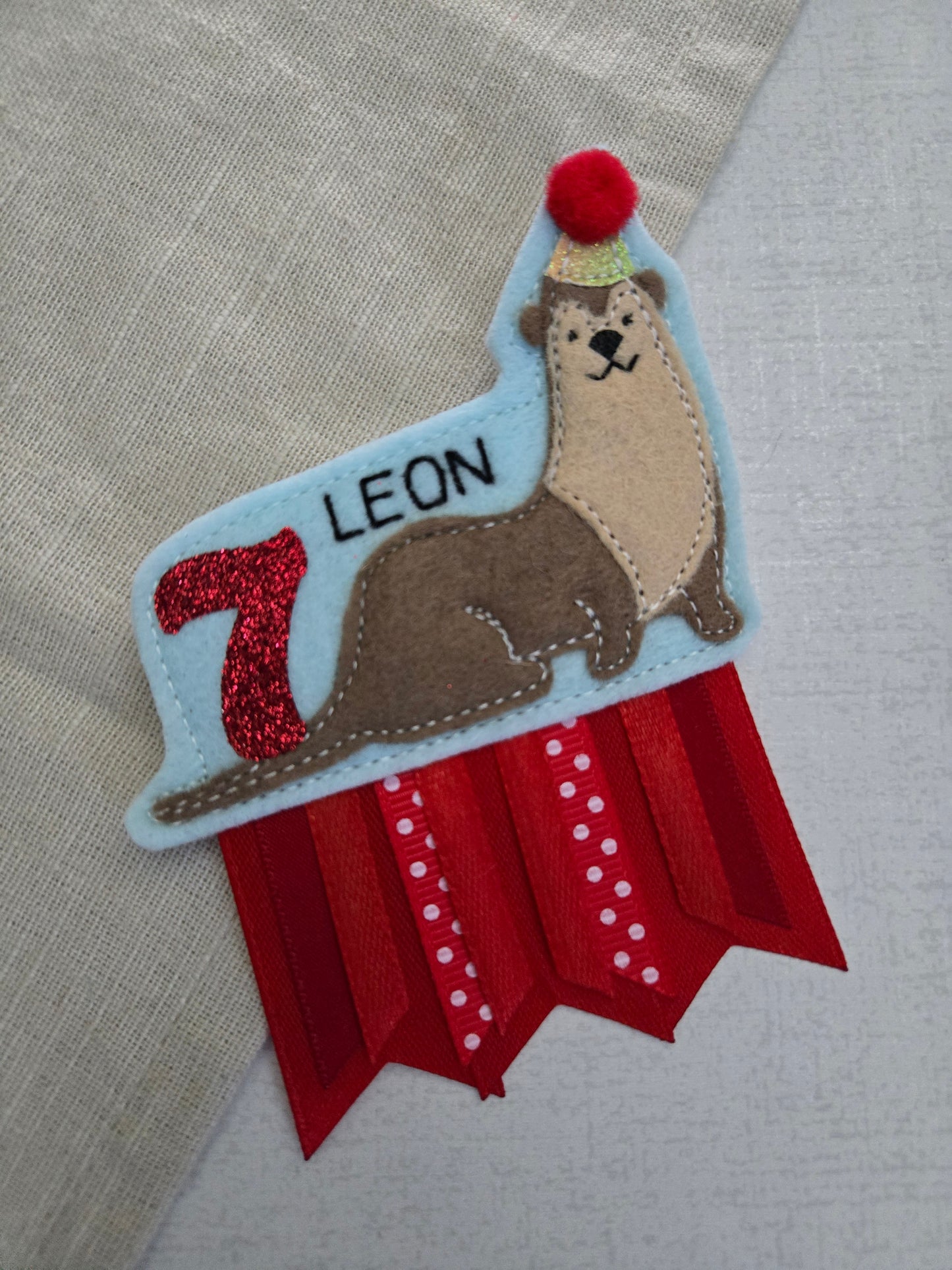 Otter birthday badge