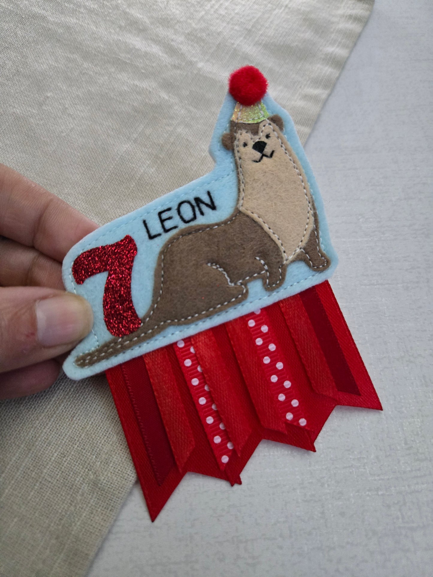 Otter birthday badge